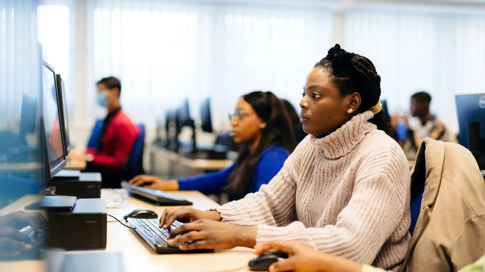 A group of students working in the computer suite