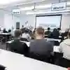 A class full of prospective students receiving a subject talk at an open day