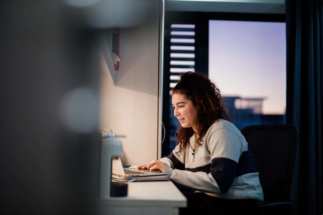 Student studying on a laptop in The Courtyard