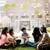 Student Ambassadors Sat Chatting on Grass by Library