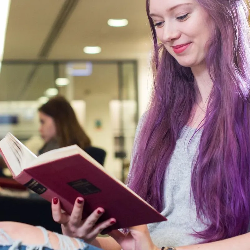 A student reading in the library