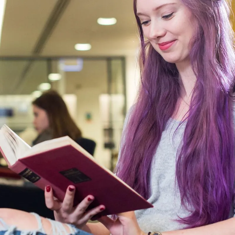 A student reading in the library