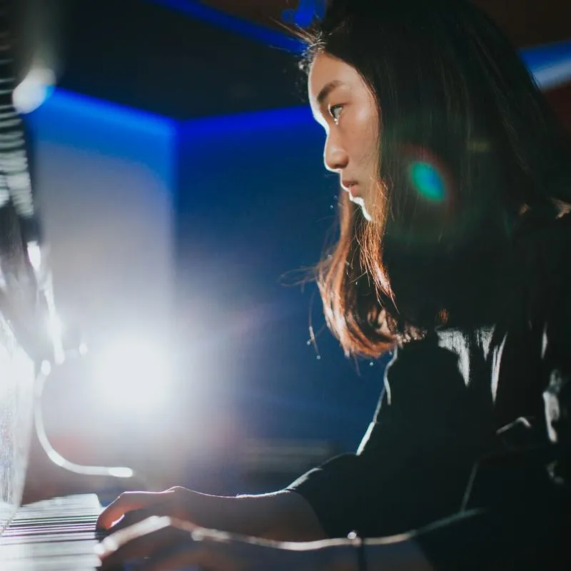 A student playing the piano