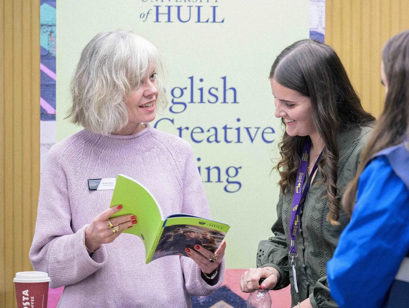 A student gaining information at a subject stand