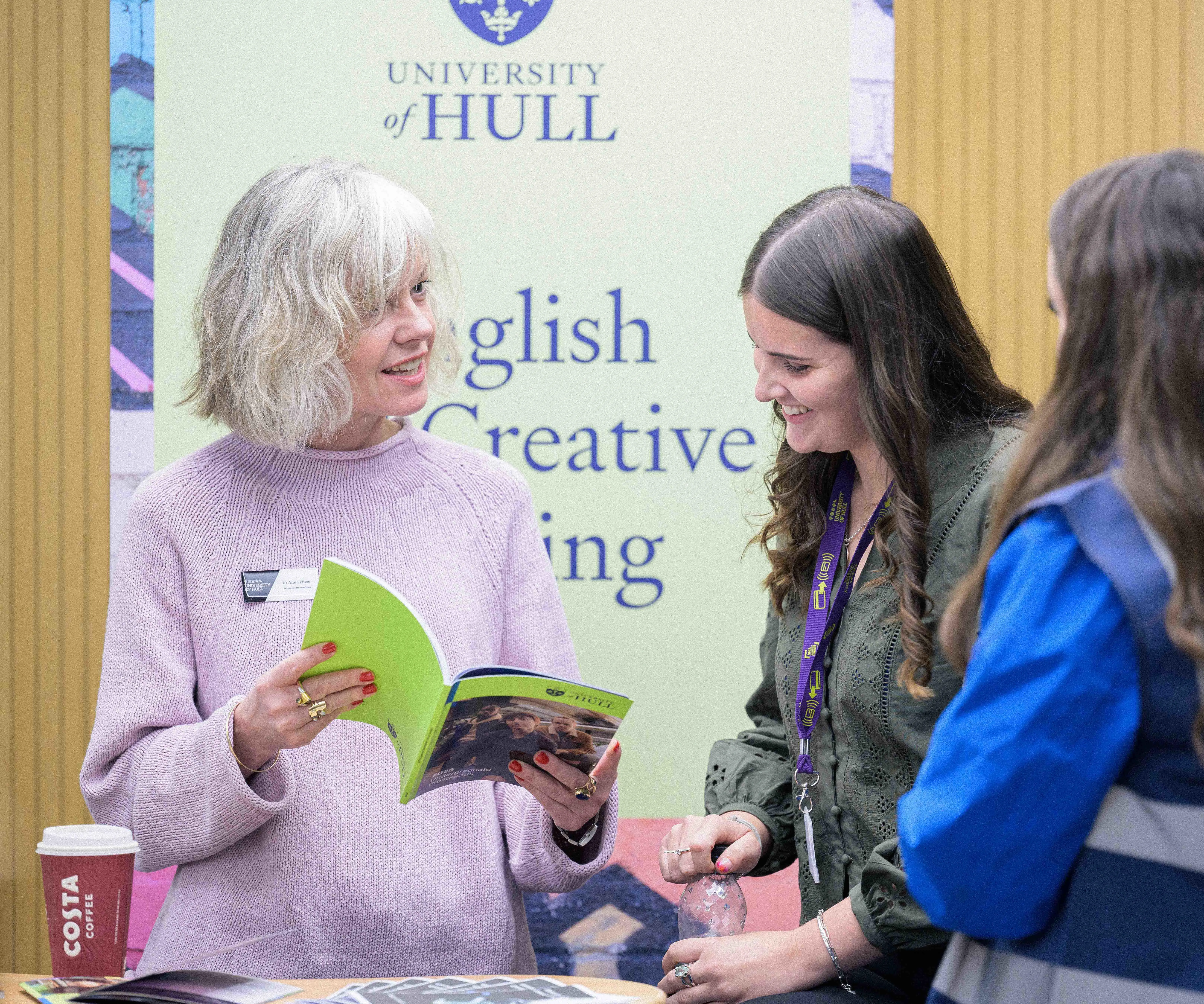 A student gaining information at a subject stand