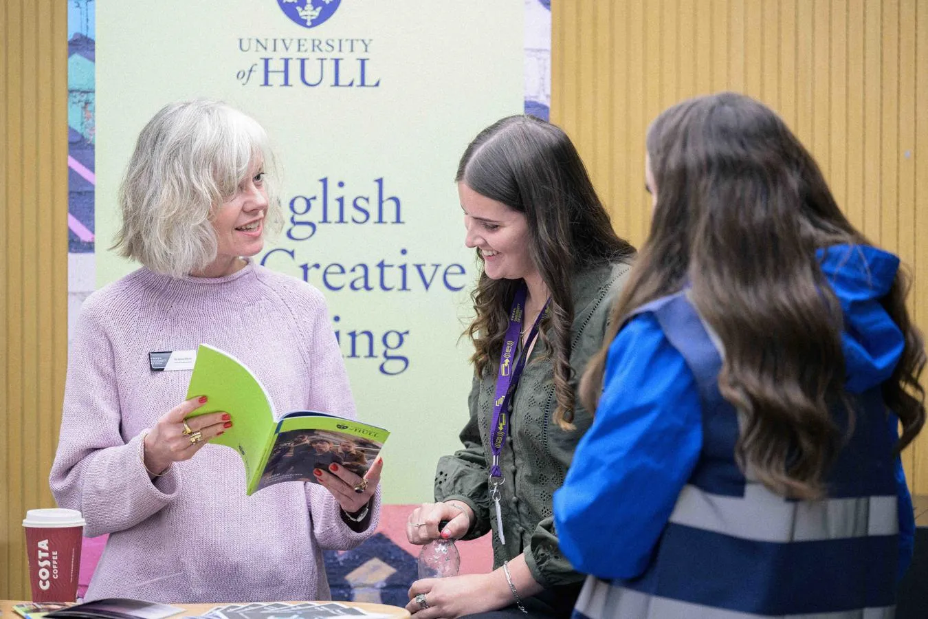 A student gaining information at a subject stand