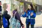 A member of staff touring some prospective students around campus