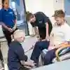 A Group of students watching a physiotherapy practical