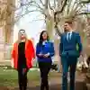 Three of our politics students walking and chatting outside the Houses of Parliament.