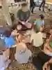 A group of young students sat on the ground