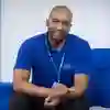 A mental health nursing student in a blue polo shirt