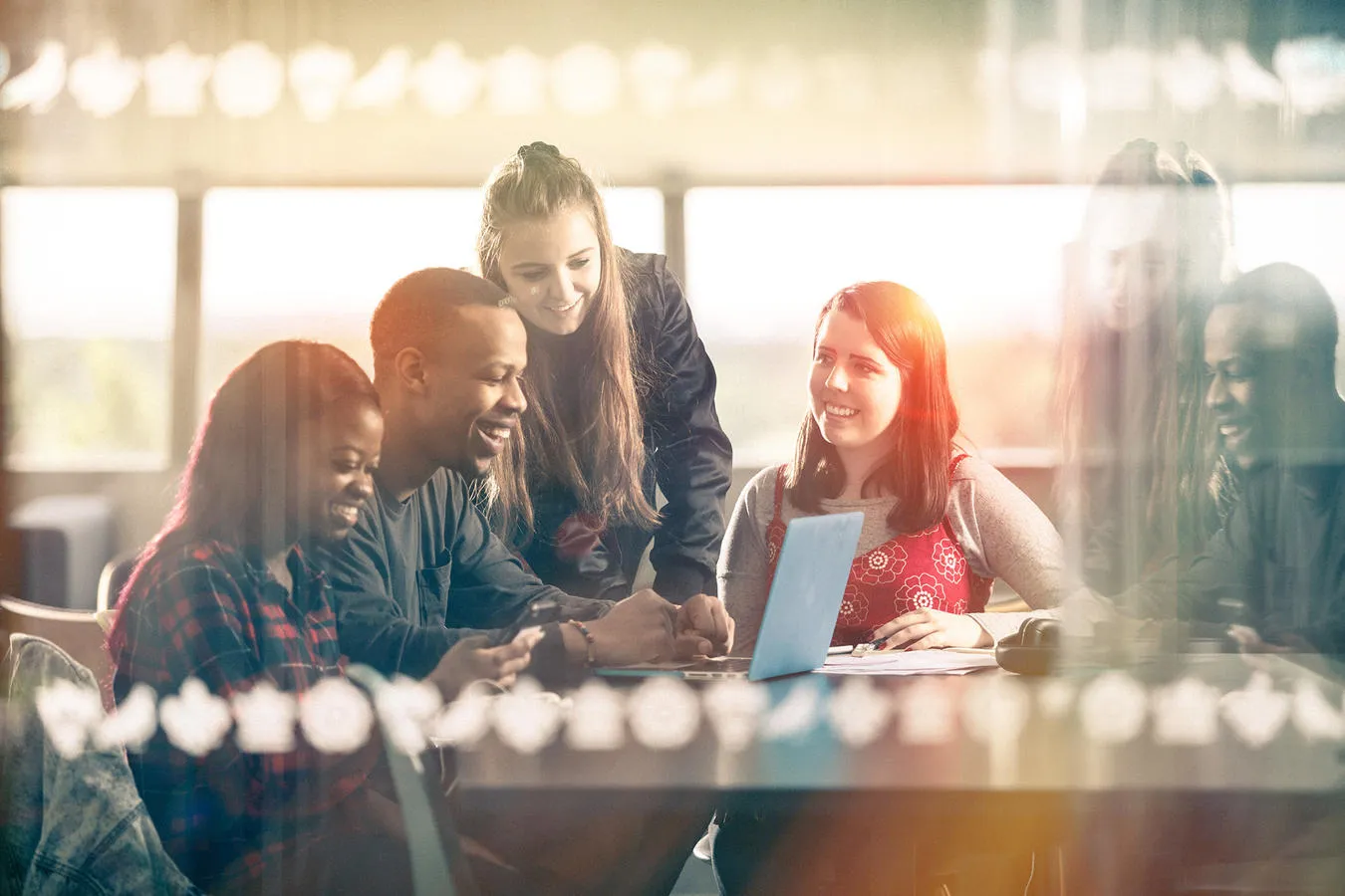 A group of students studying in the Brynmor Jones Library