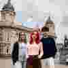 Three of Hull’s students stand confidently together in front of the Maritime Museum