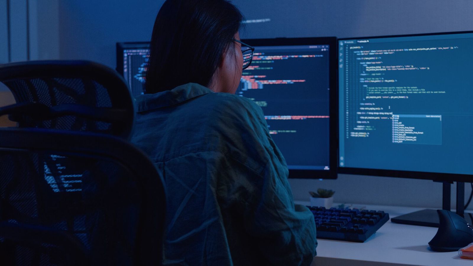 A student looking at a computer full of data