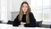 A student sat at a table in front of a window
