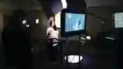 A student being filmed in a dark room