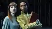 Two students stood on stage