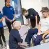 A Group of students watching a physiotherapy practical