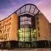 Exterior of the Allam Medical Building at dusk