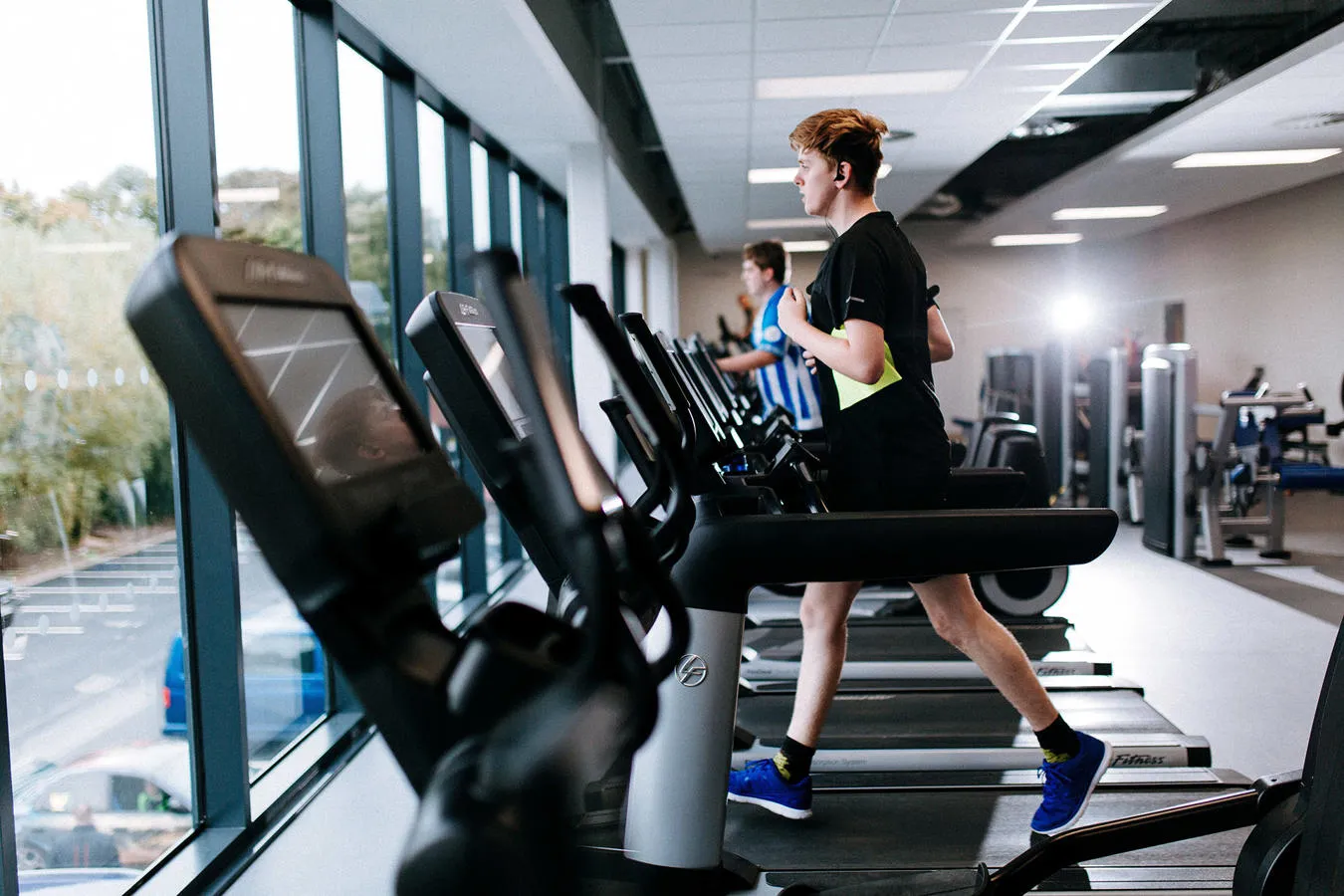 Student on treadmill looking out the window at Allam Sport Centre