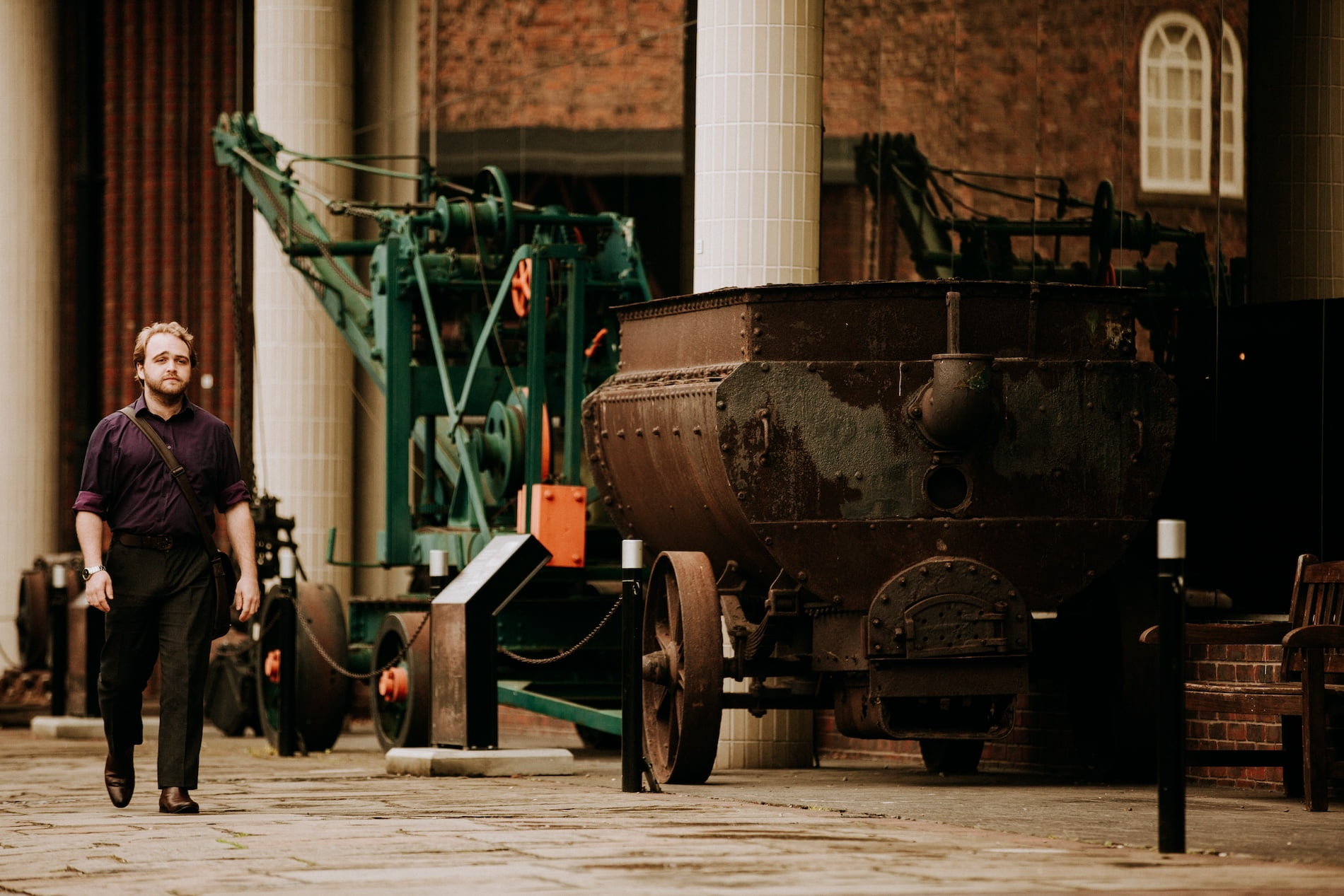 Hull History student, Andrew Ede, walking by the Hull Transport Museum in the Museums Quarter of the Old Town.