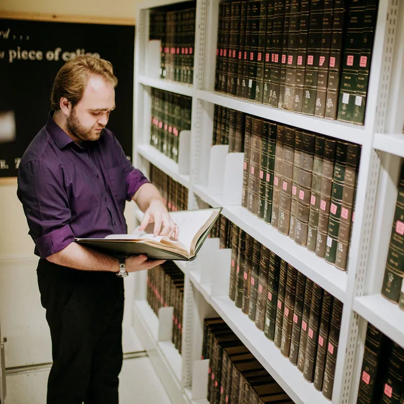 History Student, Andrew Ede, in Library