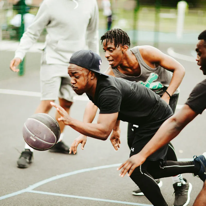 A group of students playing basketball