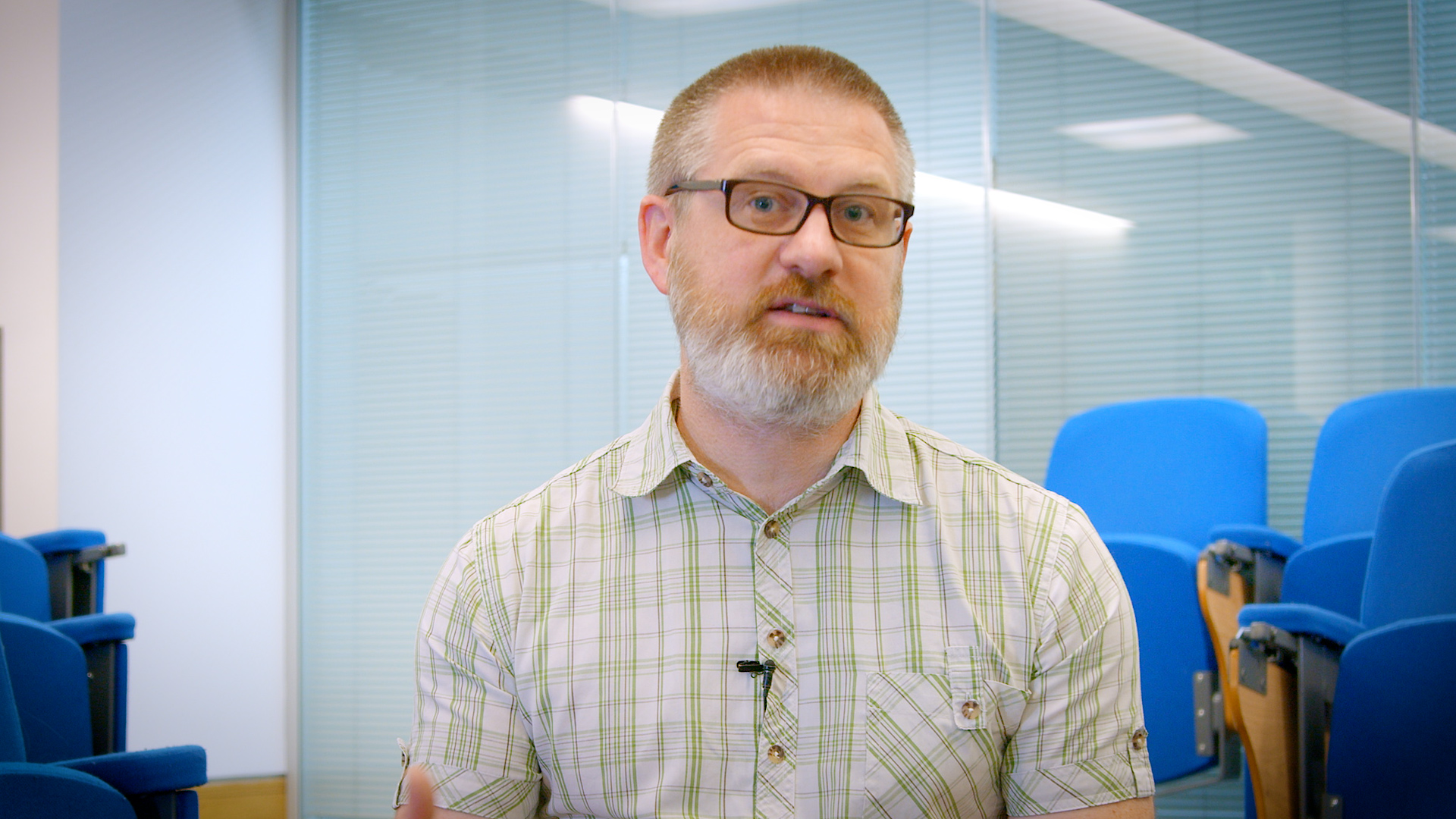 Dr Mark Walker sat in a lecture theatre