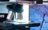 A biological research microscope lens