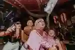 Bongo's Bingo image of people enjoying themselves tipping confetti down tops