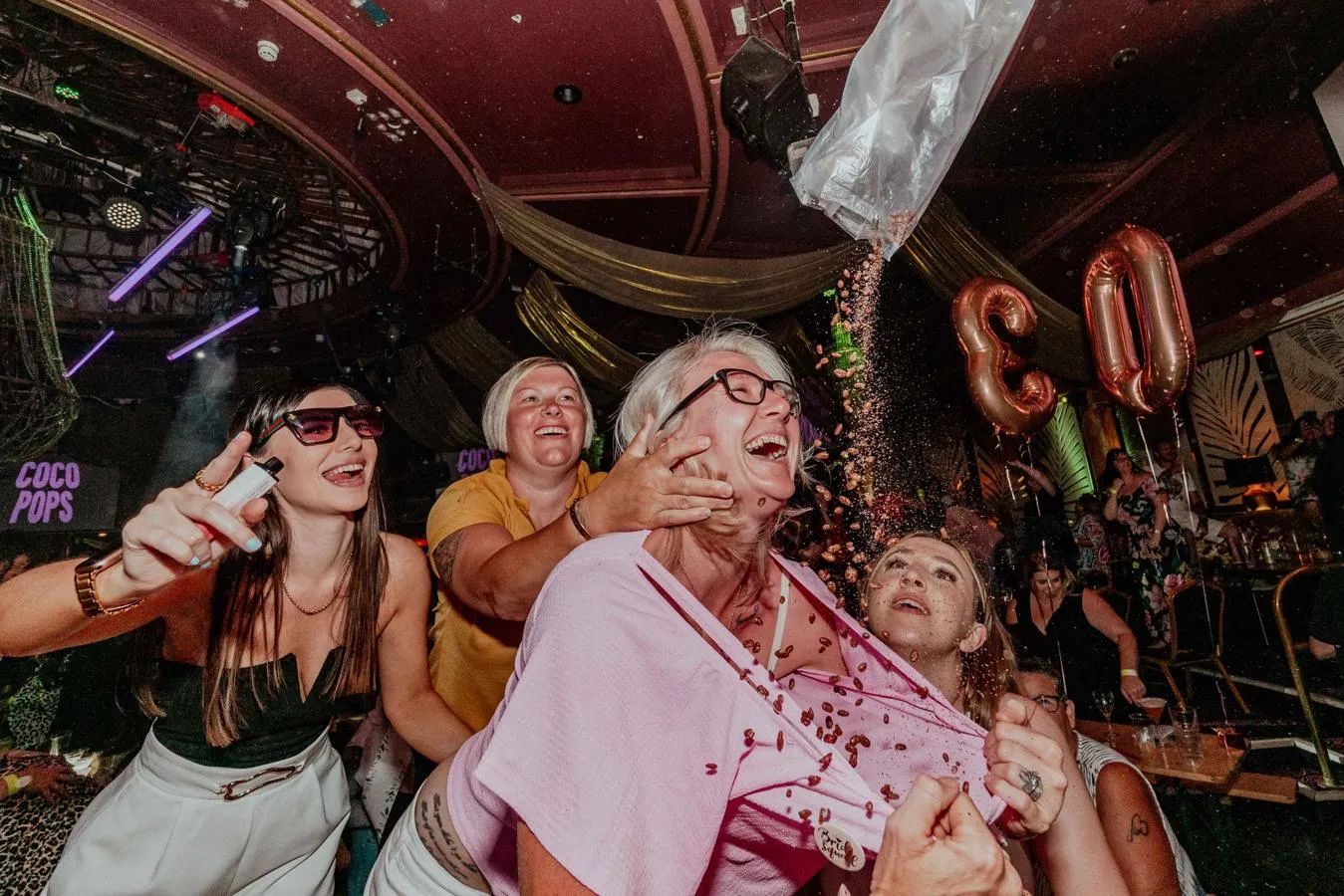 Bongo's Bingo image of people enjoying themselves tipping confetti down tops