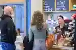 A student and her dad are served by one of our baristas at an on-campus cafe