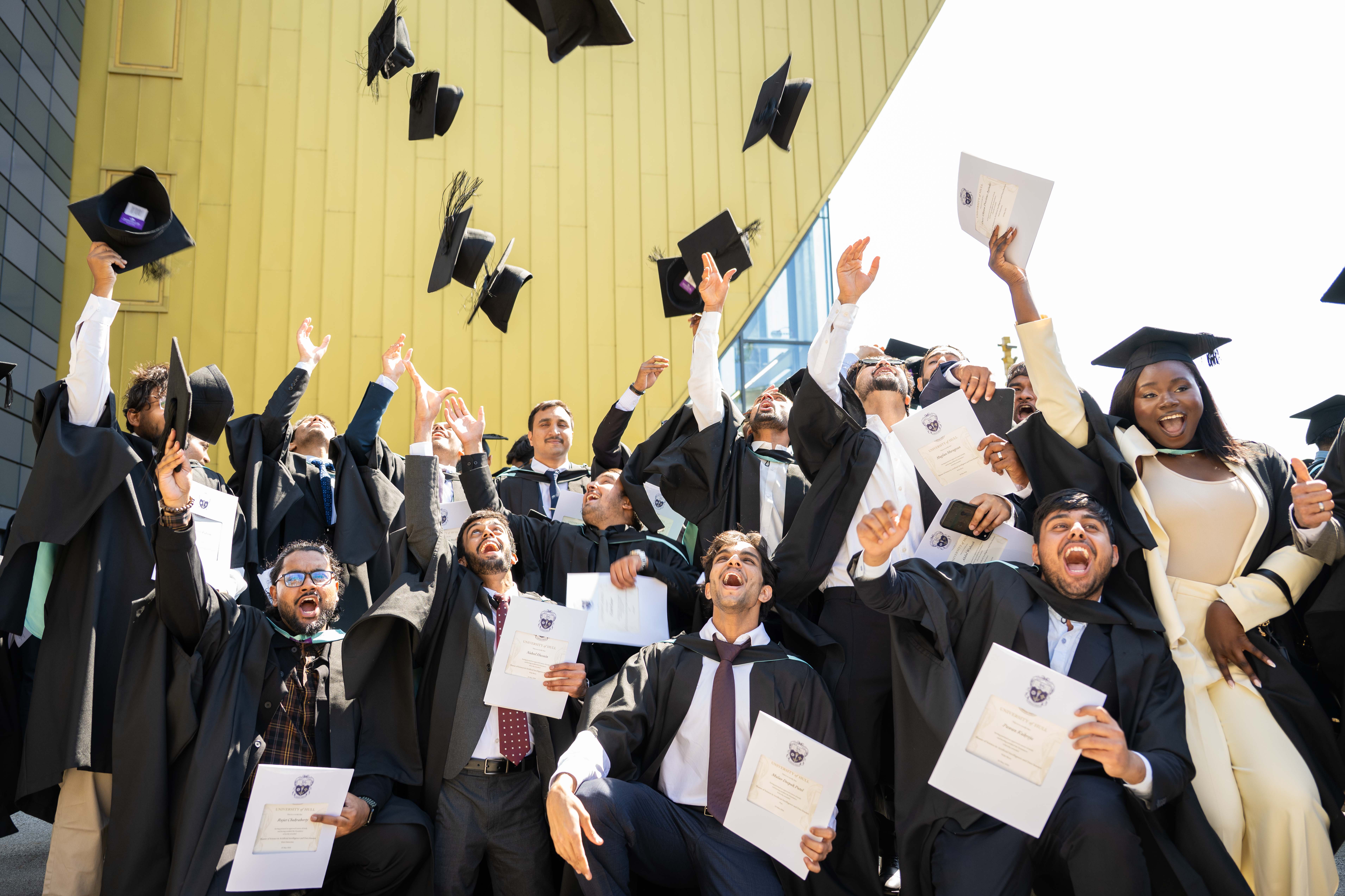 Graduates celebrating their degrees.