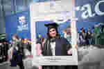 Graduand holding social media picture frame