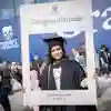Graduand holding social media picture frame