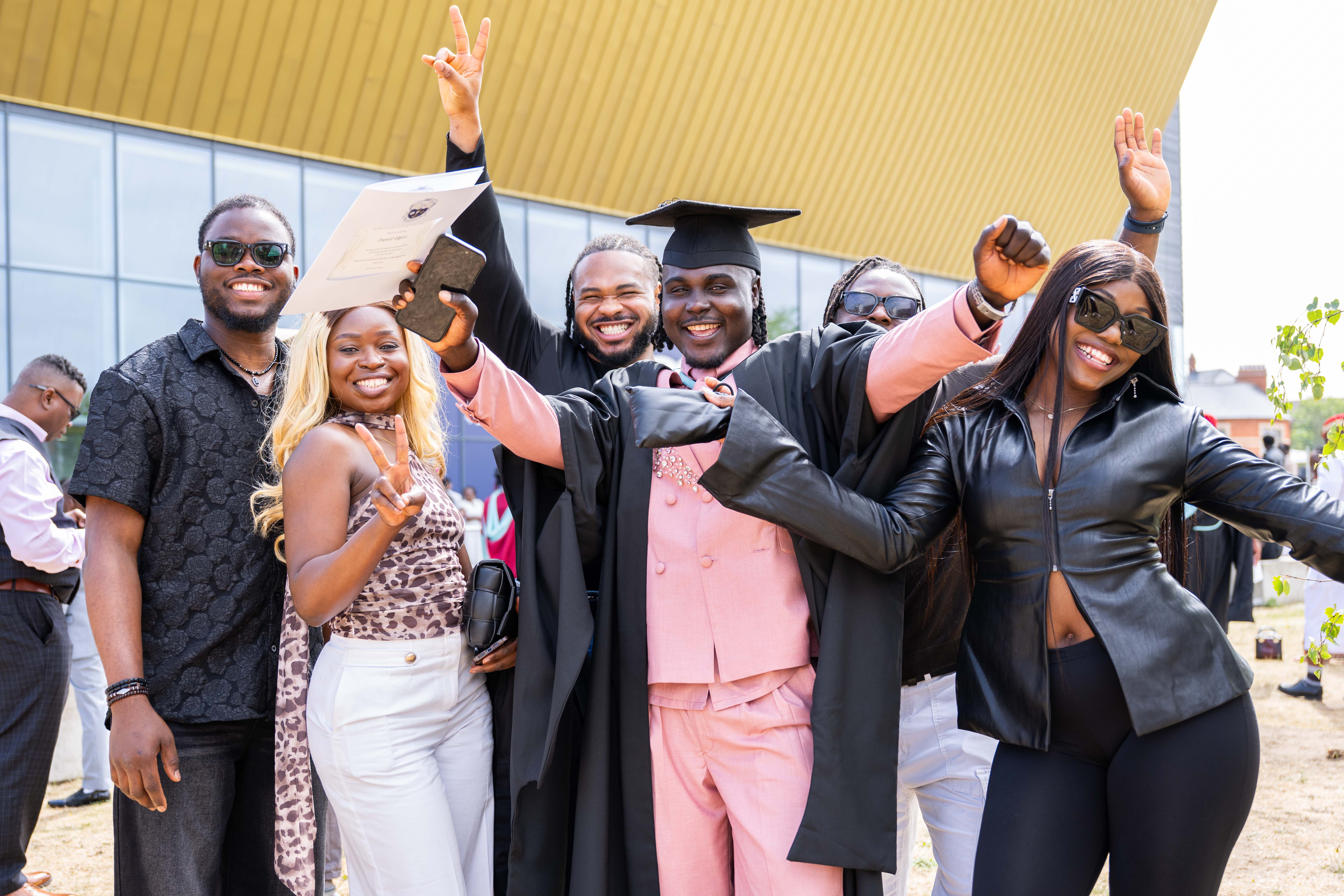 Family and friends supporting a recent graduate. 