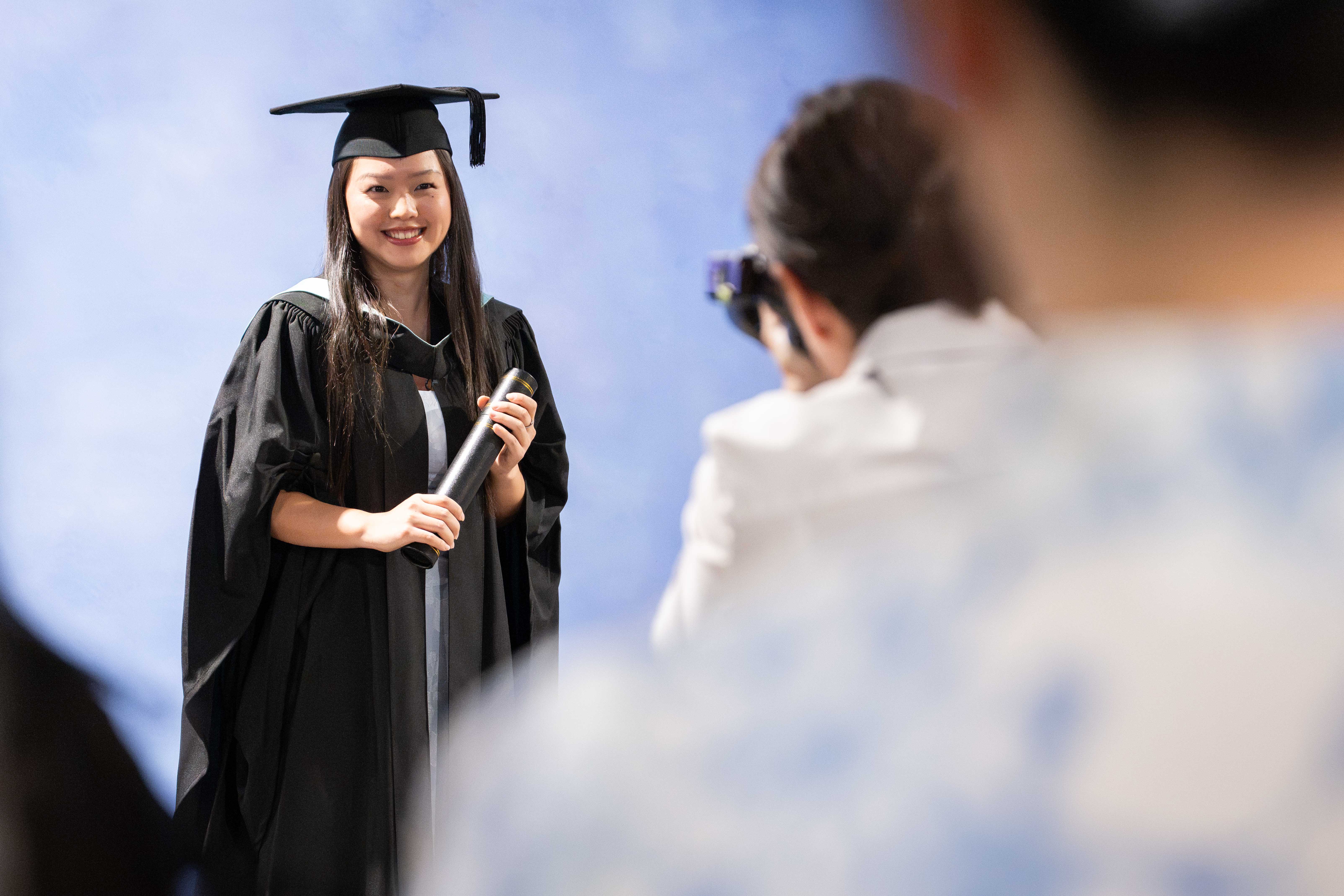Graduate posing for professional photos.