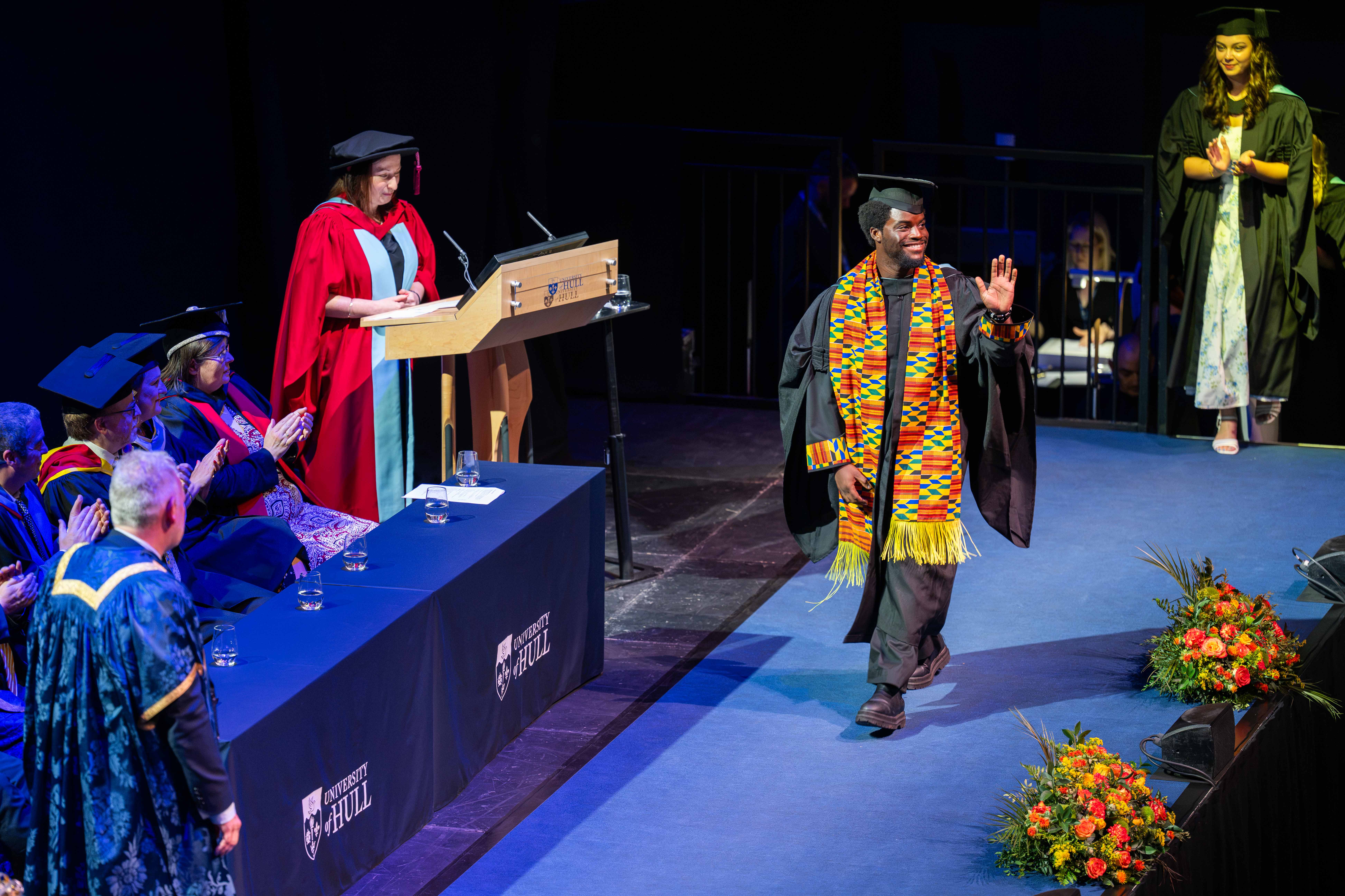 Graduate takes to the stage. 
