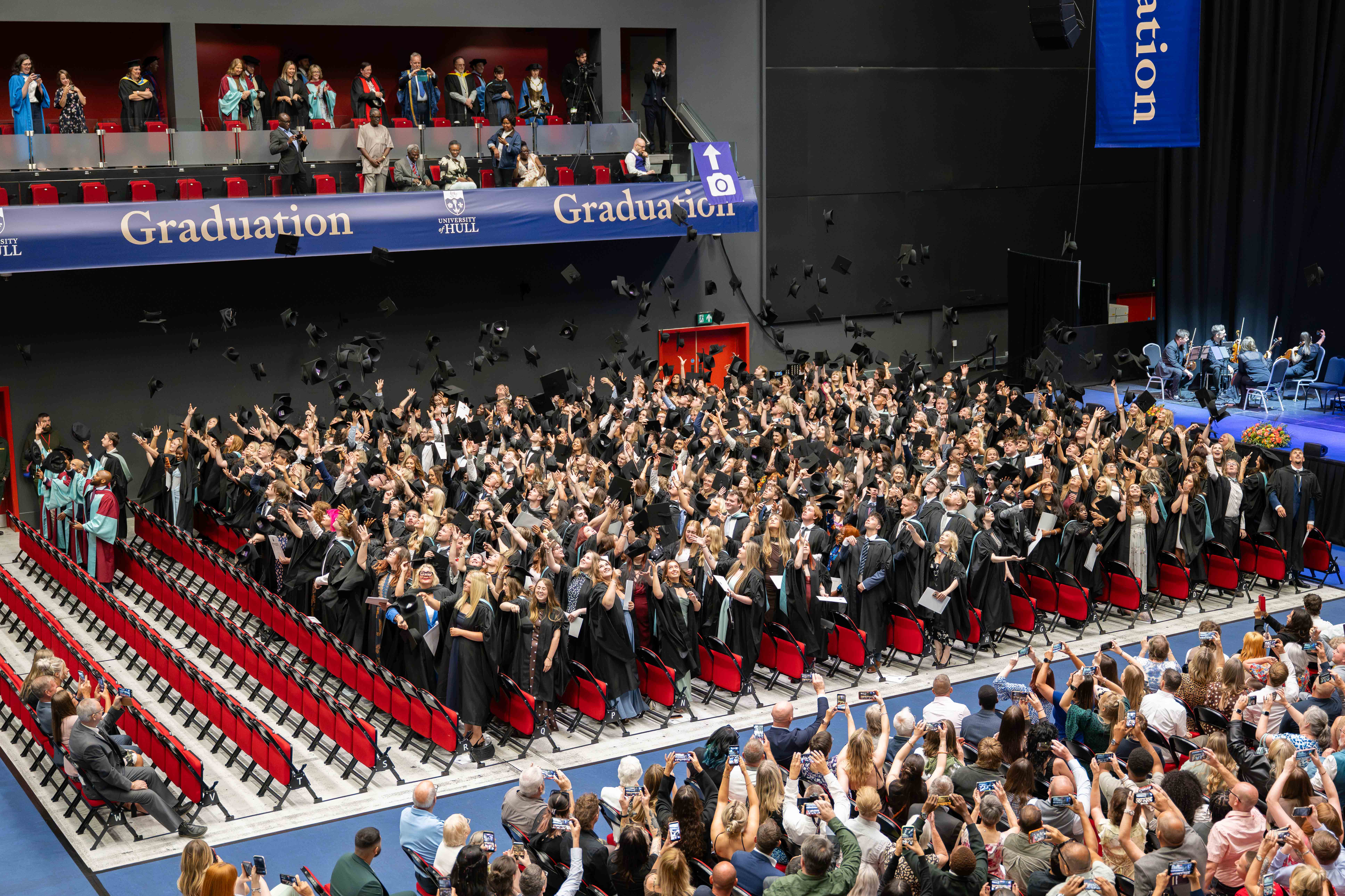Graduates celebrate with the traditional cap throw. 