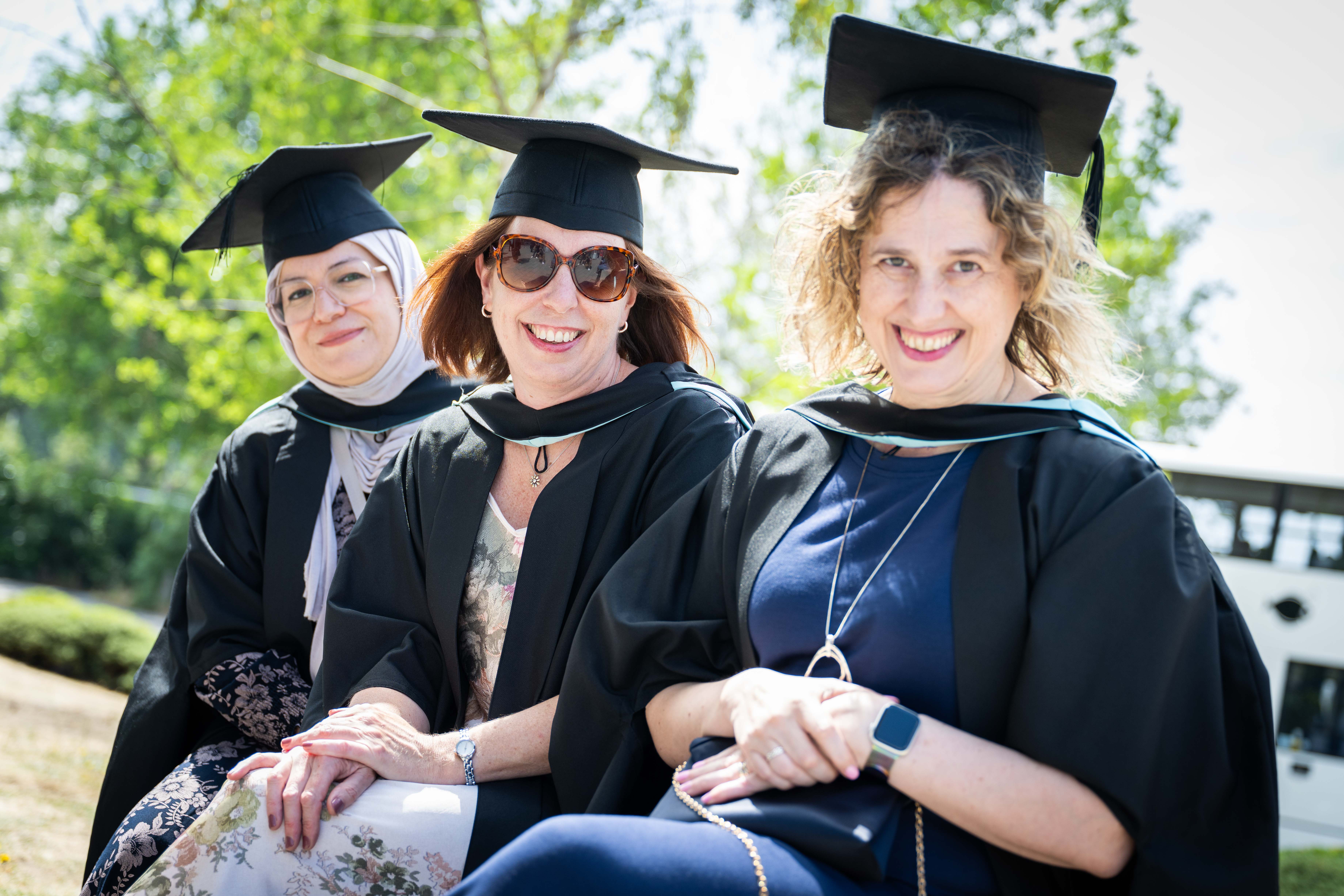 Three graduates.