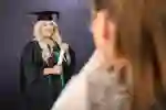 Studeng posing for official graduation photo