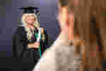 Studeng posing for official graduation photo
