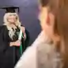 Studeng posing for official graduation photo