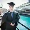 Graduate posing outside Princes Quay shopping centre.