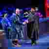 Graduate shaking the hand of Vice Chancellor Tom Lawson.