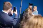 student and mum posing for a family graduation photo