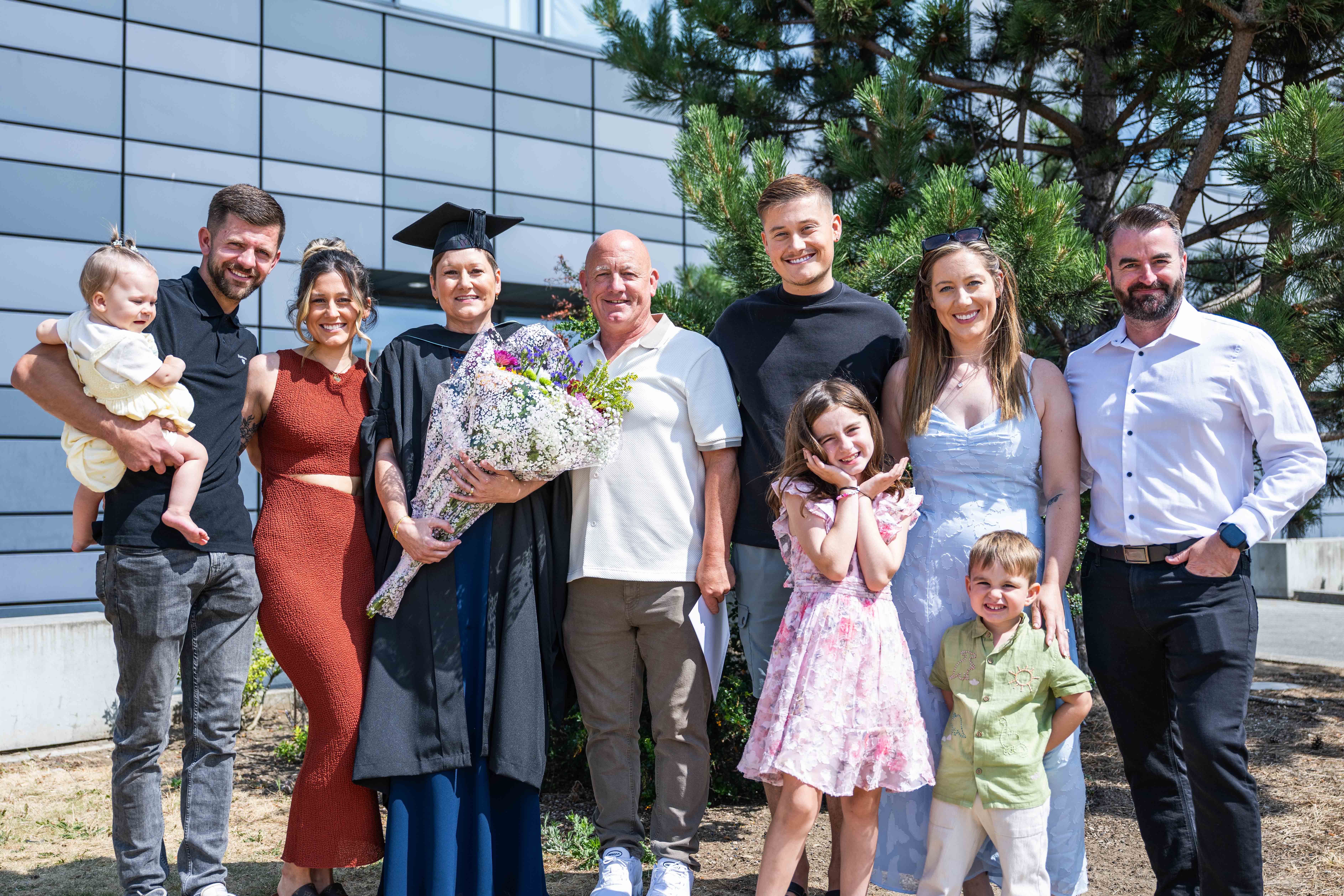 A recent graduate celebrating with their family. 
