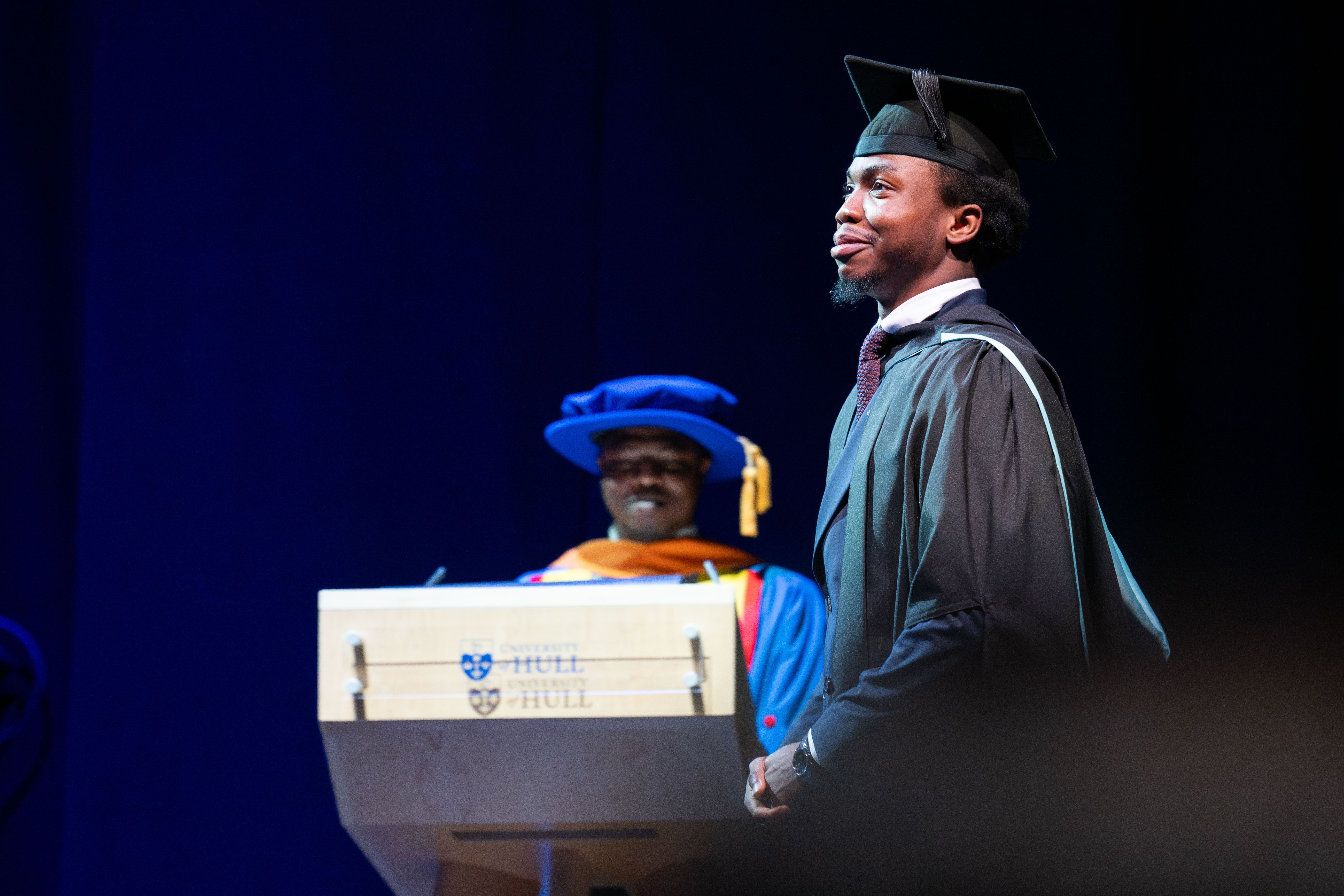 Graduate prepares for their walk across the stage. 