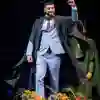 Graduate celebrates onstage.