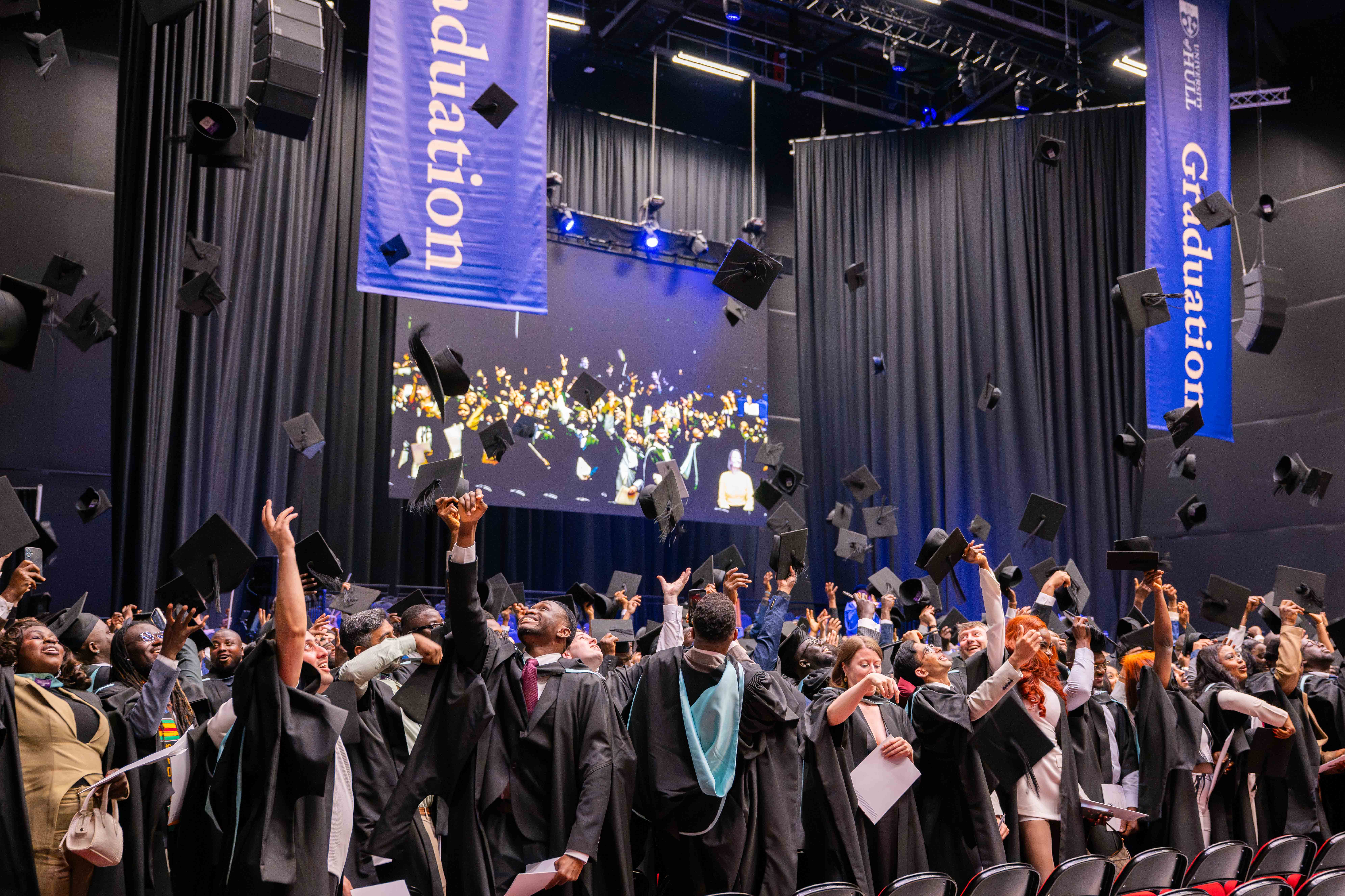 Graduates during the traditional cap throw. 